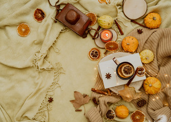 Flat lay Autumn composition. Pumpkins, candles, dried leaves on cozy background. Autumn, fall, halloween concept. Flat lay, top view, copy space