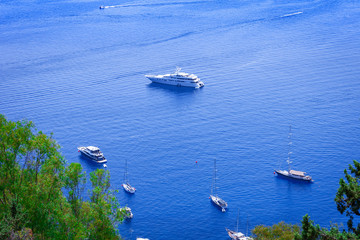 Obraz premium Sailboats near the sea shore of Taormina, Sicily, Italy