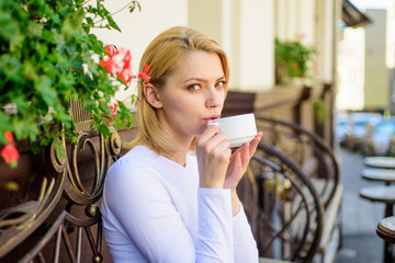 Mug of good coffee in morning gives me energy charge. Girl drink coffee every morning at same place...