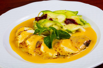 Chicken breast in orange sauce