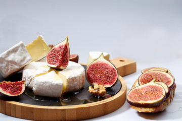 Camembert cheese sandwich with figs, nuts and honey