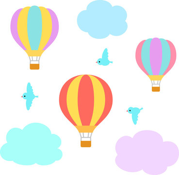 空を飛ぶ気球と小鳥