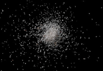 Himalayan salt pile isolated on black background, top view