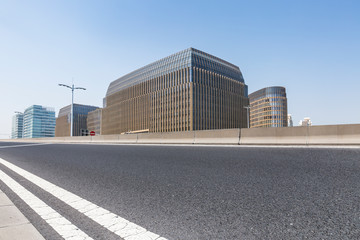 Panoramic skyline and modern business office buildings with empty road,empty concrete square floor