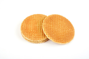 Dutch waffle called a stroopwafel isolated on a white background.