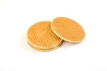 Dutch waffle called a stroopwafel isolated on a white background.