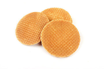 Dutch waffle called a stroopwafel isolated on a white background.