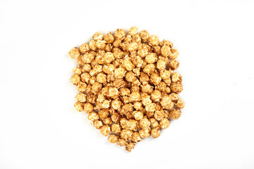 Pile of caramel popcorn on white background.