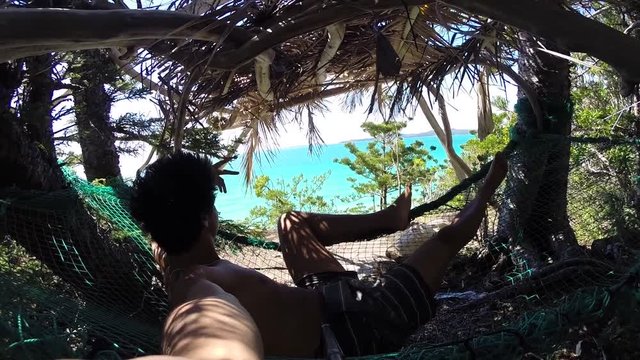 Selfie Of A Man Smiling And Chilling In A Hammock In Front Of The Ocean. Location Australia Whitsundays Islands