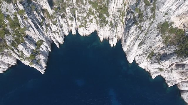 Beautiful creek from vertical top view by drone. Mediterranean sea along cliffs. Calanque marseille south of France.