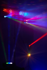 Stage lights in action at the concert. Lights show. Lazer show. Night club dj party people enjoy of music dancing sound with colorful light. club night light dj party club. Smoke Machine and lights