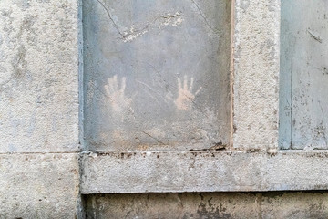 wall with two handprints