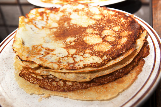 Pile of Pancakes Keeping Warm on plate