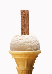 VANILLA ICE CREAM CONE WITH CHOCOLATE FLAKE ISOLATED ON WHITE BACKGROUND