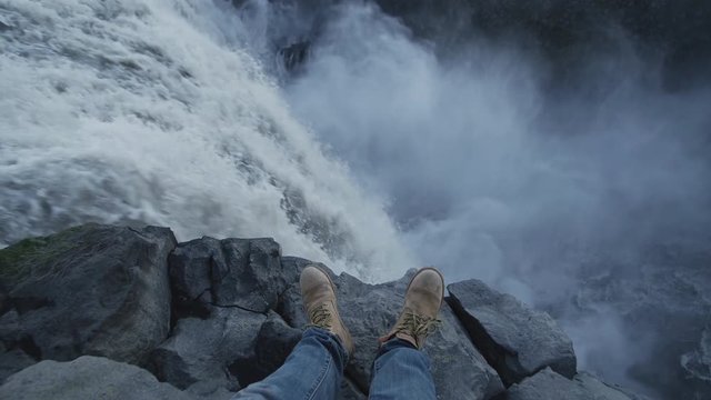 Man standing next to Detifoss waterfall in Iceland. Personal point of view