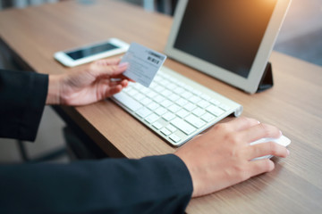 Fototapeta premium businesswoman hands using table, cell phone and credit card