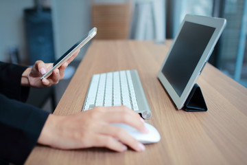 businesswoman hands using table and cell phone