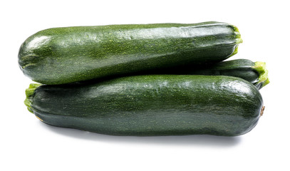 Fresh zucchinis on white background