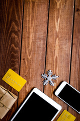smartphone, tablet, shopping for new year online wooden table