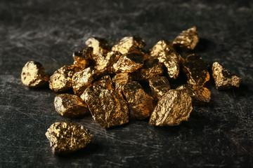 Gold nuggets on black background