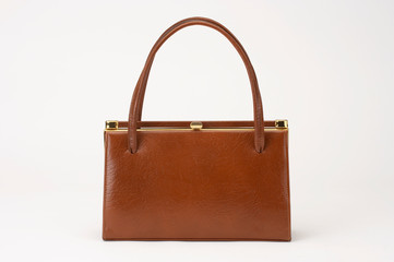 BROWN LADIES LEATHER HANDBAG ISOLATED ON WHITE BACKGROUND