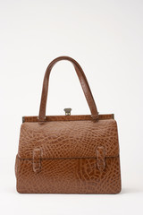 BROWN LADIES CROCODILE SKIN HAND BAG ON WHITE BACKGROUND