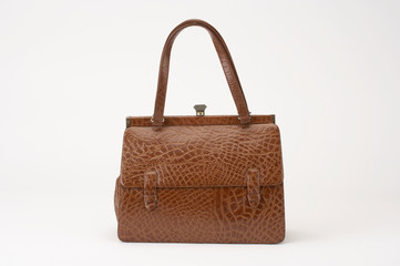 BROWN LADIES CROCODILE SKIN HAND BAG ON WHITE BACKGROUND