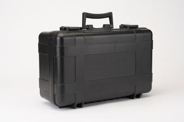 BLACK PLASTIC BRIEFCASE ON WHITE BACKGROUND