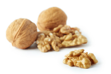 Close up of walnut kernels isolated on white background