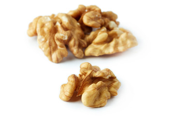 Close up of walnut kernels isolated on white background