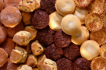 SELECTION OF BUNS CAKES PASTRIES AND DOUGHNUTS IN BAKERY