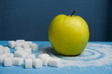 Sugar Cubes And Green Apple On The Pastel Blue Background. Concept Of Sweet Drinks, Diet, Diebetes,...