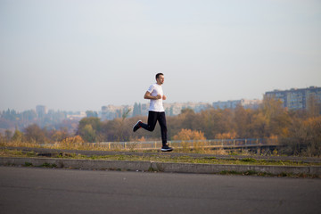 Man run at autumn morning.  Healthy lifestyle