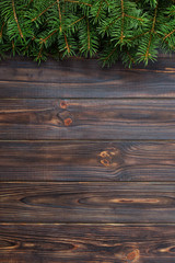 Christmas fir tree on a wooden backgrond. top view