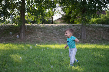 little boy running in the park