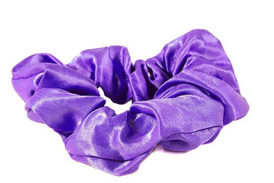 Shiny purple scrunchie for tying hair back, isolated on white background