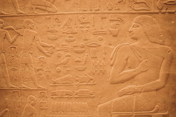 Egyptian Hieroglyphic carvings on the exterior walls of an ancient temple