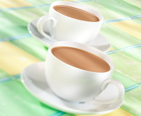TWO TEA CUPS