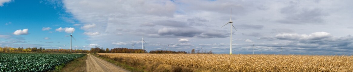 Panoramic view of wind turbine in Quebec agricultural area at late fall 