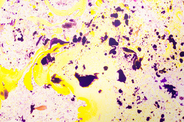 Abstract background for text or image. Ebru technique. Modern art. Marbled paper. Marbleized effect. Marble paper texture. Yellow and violet.