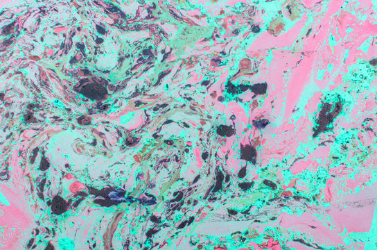 Abstract background for text or image. Ebru technique. Modern art. Marbled paper. Marbleized effect. Marble paper texture. Blue and pink.