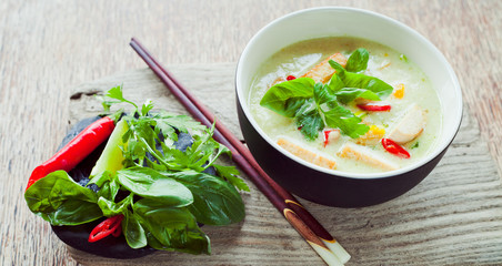 Vegan Thai Green Curry with fried firm tofu pieces, sesonal vegetable, red bird's eye chili and...