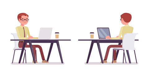 Male clerk working with laptop