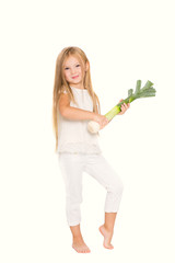 Fototapeta na wymiar Happy child with vegetables leek on a white background. Concept of healthy vegetarian food