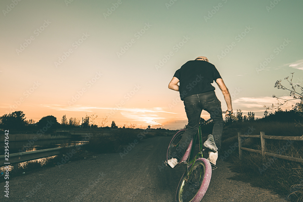 Sticker Portrait of a young man with a bmx bicycle