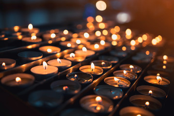 Many blazing candles. Shining fire candles. 