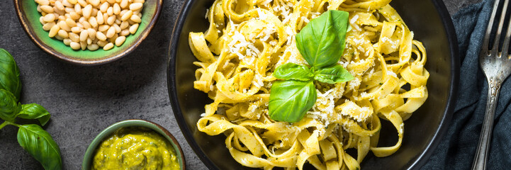Tagliatelle pasta with pesto sauce and parmesan.