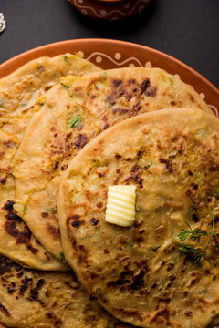 Aloo Paratha / Indian Potato stuffed Flatbread. Served with fresh curd and tomato ketchup. selective focus
