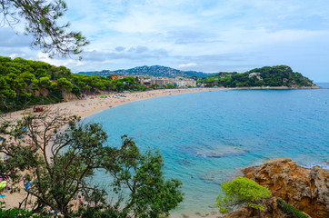 Fototapeta na wymiar Beautiful top view of beach Fenals, Lloret de Mar, Costa Brava, Spain