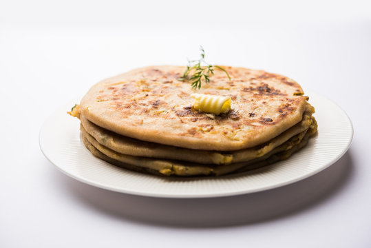 Aloo Paratha / Indian Potato stuffed Flatbread. Served with fresh curd and tomato ketchup. selective focus